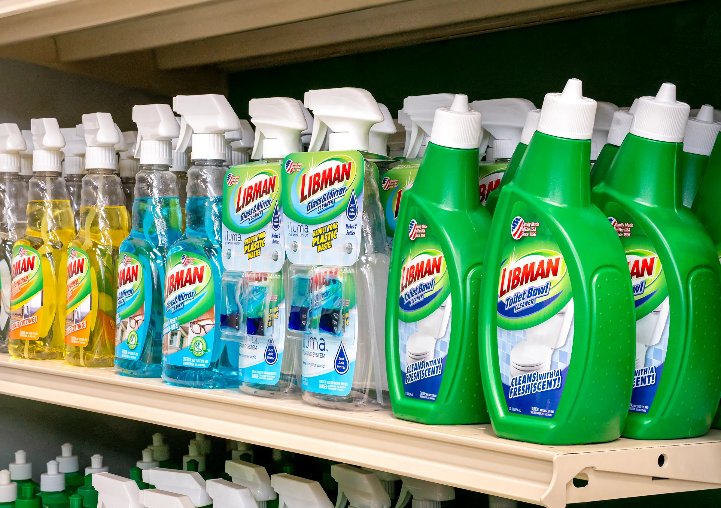 Group of liquid cleaning solutions arranged on a retail shelf