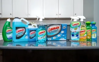 Array of liquid cleaning solutions arranged on a kitchen counter